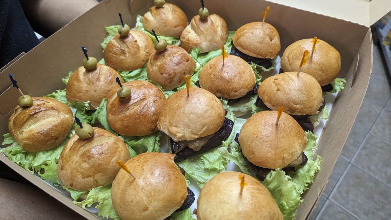 Steak slider appetizers with olive garnish